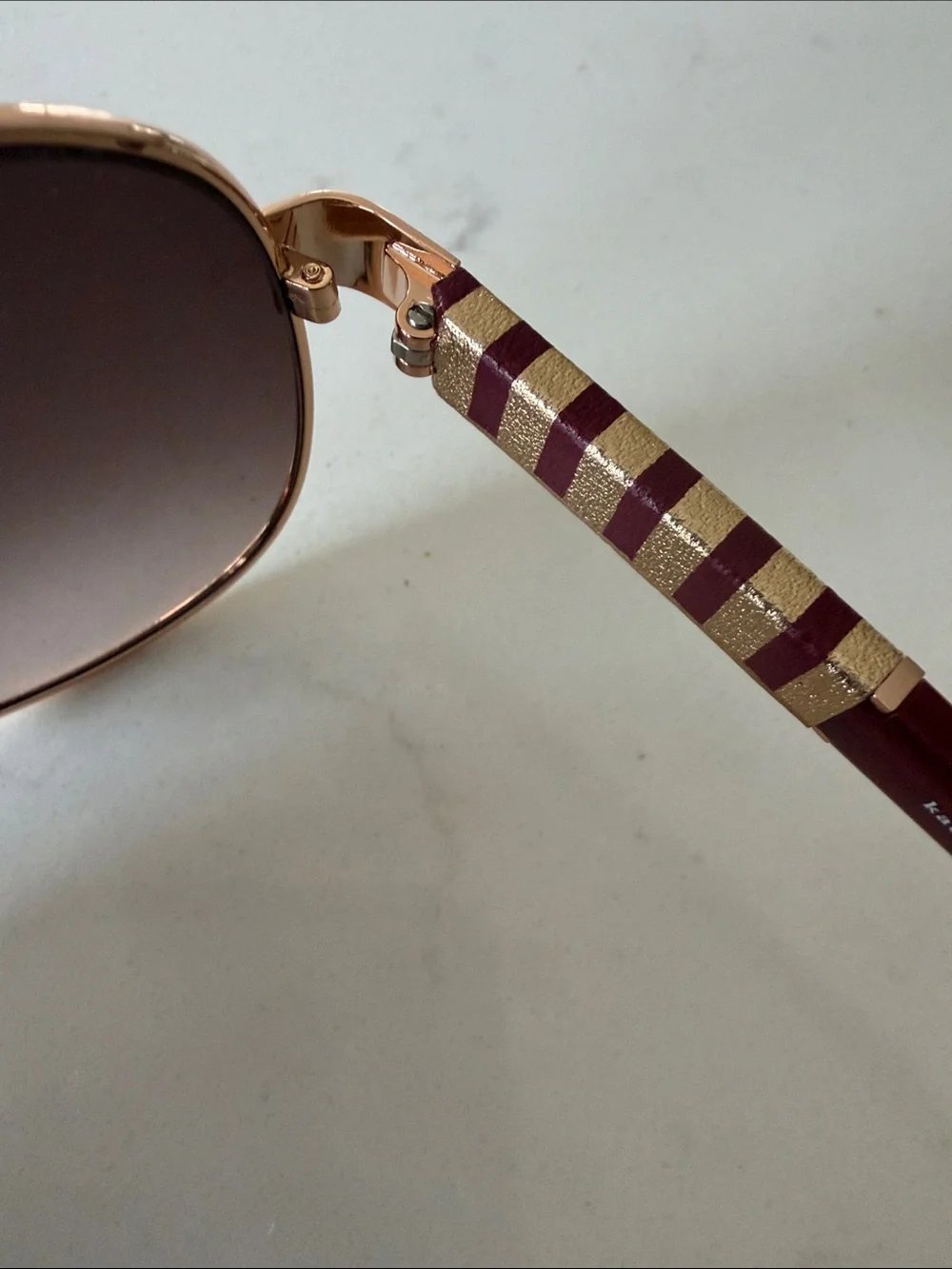 kate spade Rose Gold Frame Sunglasses with Burgundy Temples